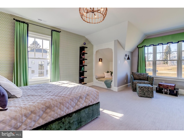 bedroom with carpet, vaulted ceiling, and an inviting chandelier