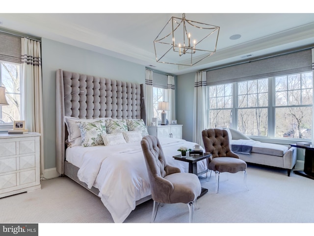 bedroom with carpet, multiple windows, and a chandelier