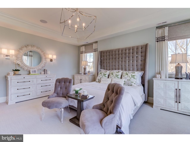 bedroom featuring light colored carpet and a notable chandelier