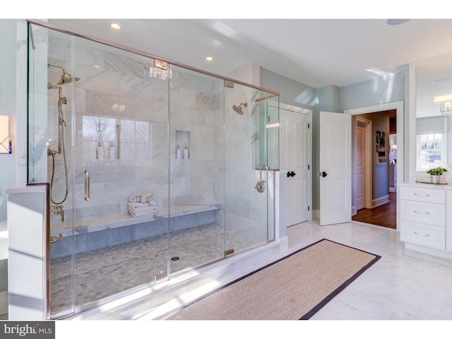 bathroom featuring tile patterned flooring and a shower with shower door