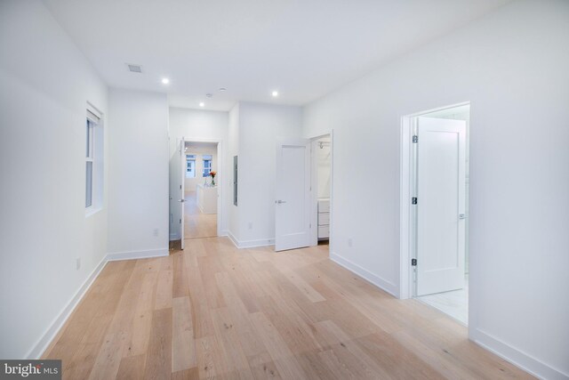 hallway with light wood-type flooring