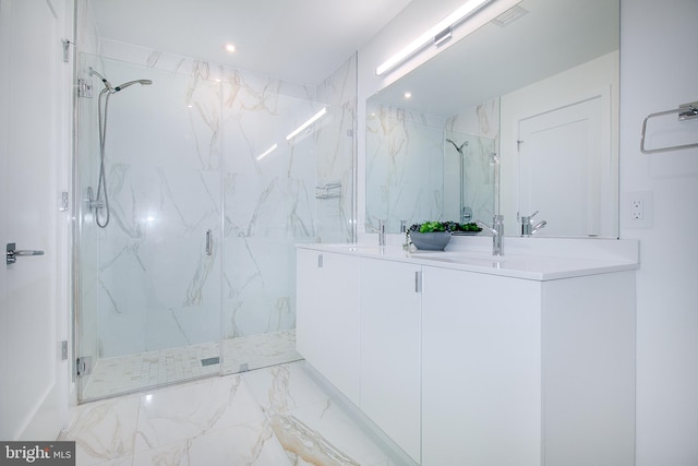 bathroom featuring vanity and a shower with door