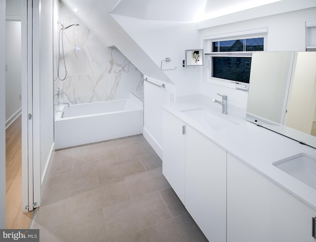 bathroom with vanity, tile patterned floors, and tiled shower / bath combo