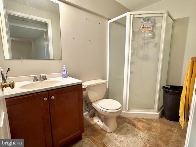 bathroom with an enclosed shower, vanity, tile patterned floors, and toilet