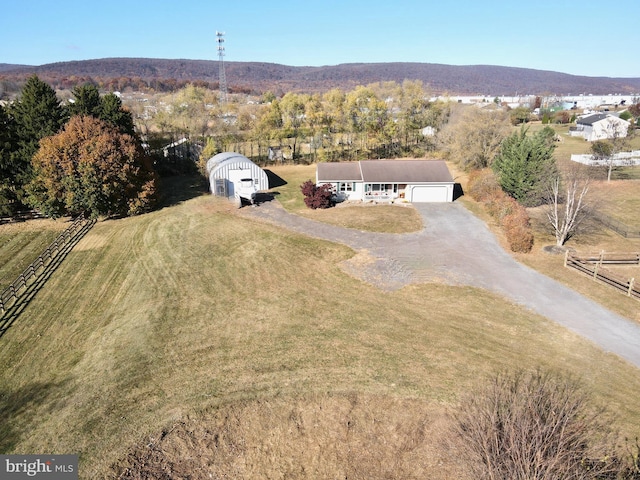 drone / aerial view with a mountain view and a rural view