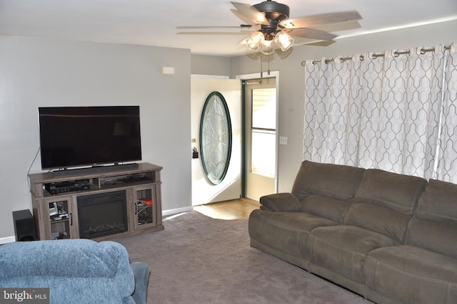 living room featuring carpet and ceiling fan