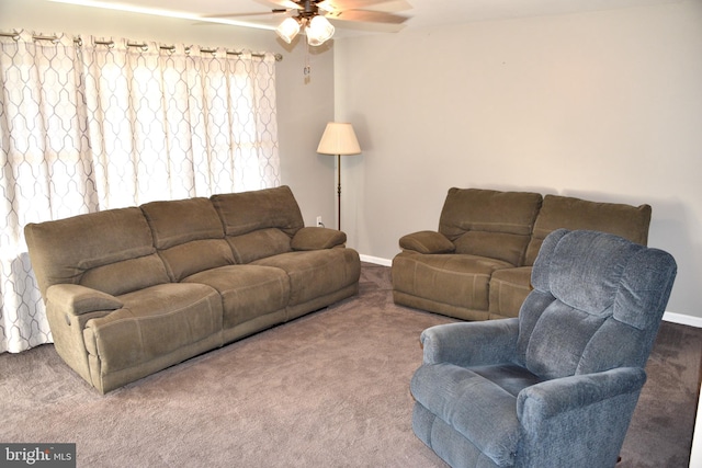 living room with ceiling fan and carpet floors