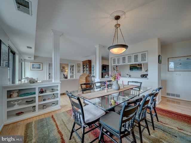 dining space featuring light hardwood / wood-style floors