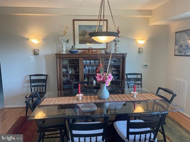 dining space featuring hardwood / wood-style floors