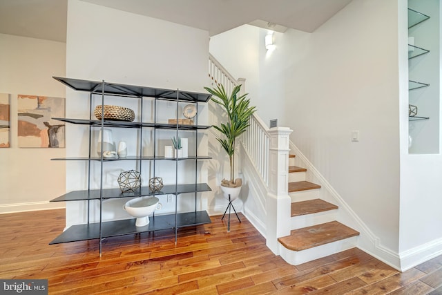 stairway featuring hardwood / wood-style floors