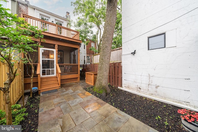 view of patio featuring a sunroom