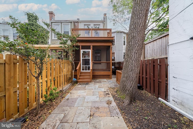 rear view of house featuring a balcony