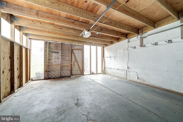 miscellaneous room featuring a wealth of natural light and concrete floors