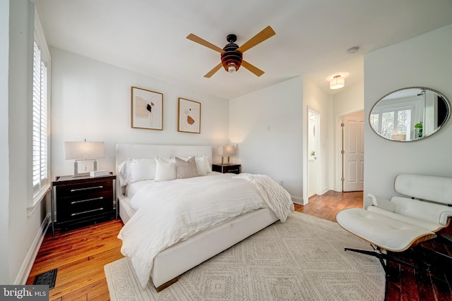 bedroom featuring hardwood / wood-style flooring and ceiling fan