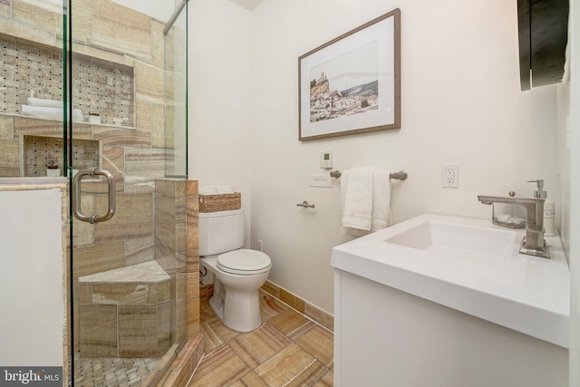 bathroom with walk in shower, vanity, and toilet