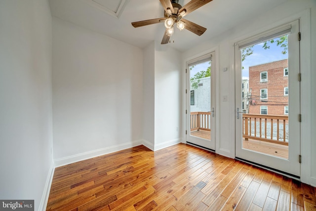 doorway to outside featuring ceiling fan and light hardwood / wood-style floors