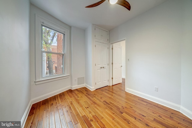 unfurnished bedroom featuring light hardwood / wood-style flooring and ceiling fan