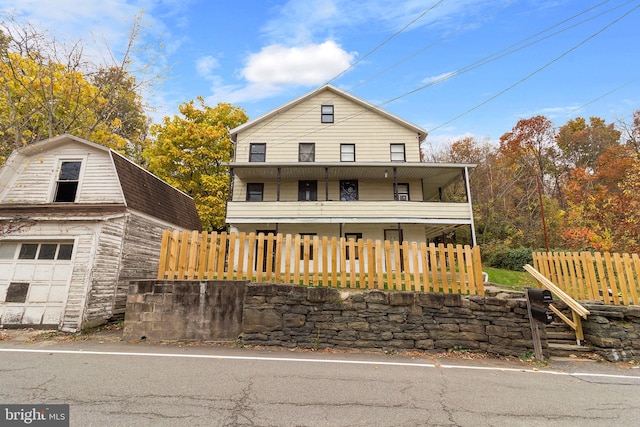 view of front of property featuring a garage and covered porch