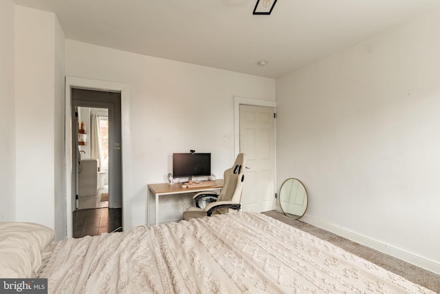 bedroom with wood-type flooring