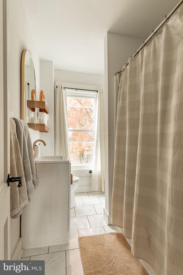 bathroom featuring toilet and sink