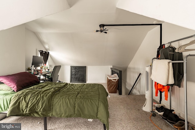 carpeted bedroom featuring lofted ceiling