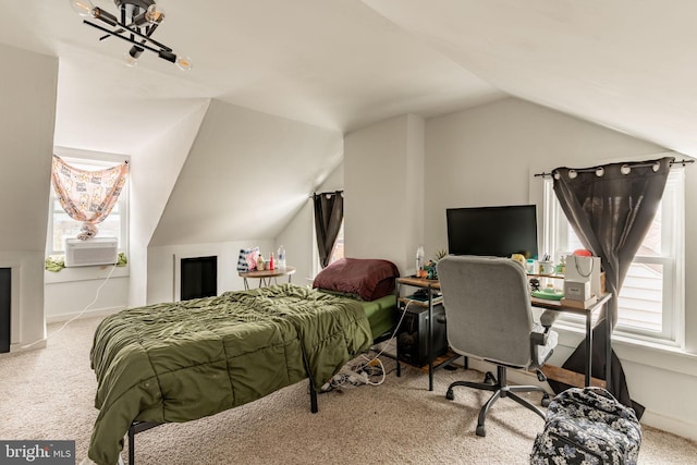 carpeted bedroom featuring lofted ceiling