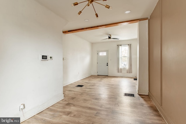 foyer with beamed ceiling, ceiling fan, and light hardwood / wood-style flooring