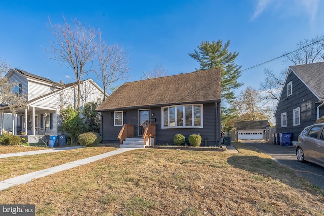 view of front of house with a front lawn and a garage