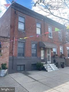 view of front facade with a patio area