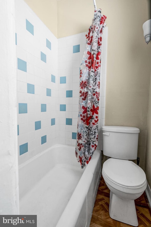 bathroom with toilet and parquet flooring