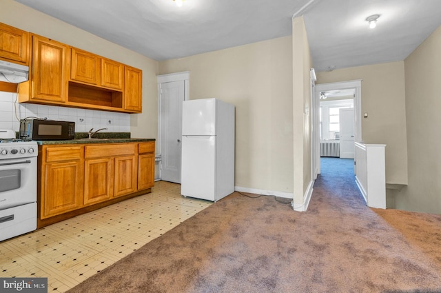 kitchen with light colored carpet, radiator, decorative backsplash, ventilation hood, and white appliances