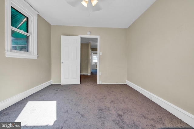 unfurnished bedroom featuring carpet flooring and ceiling fan