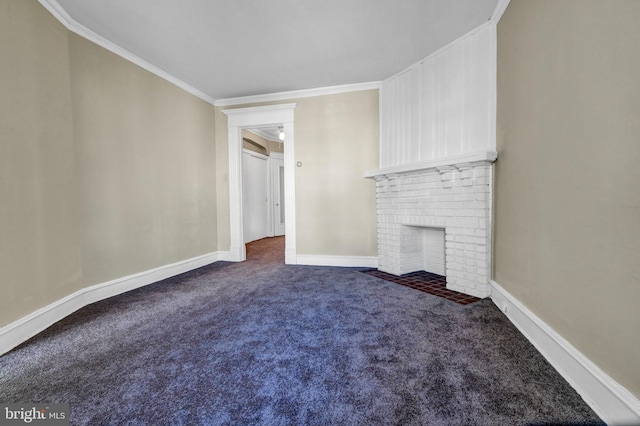 unfurnished living room featuring a fireplace, dark carpet, and crown molding