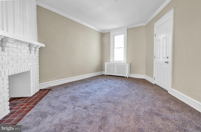 unfurnished living room with radiator, dark carpet, ornamental molding, and a fireplace