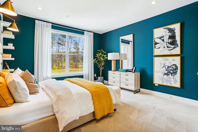 bedroom featuring light colored carpet