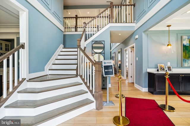 stairway with hardwood / wood-style flooring