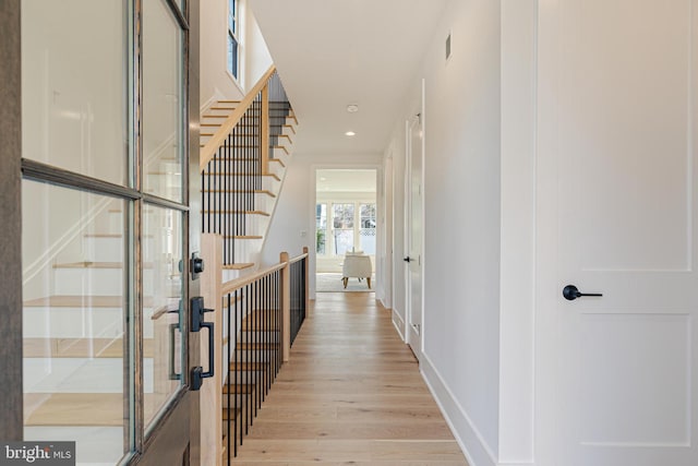 hall with light hardwood / wood-style flooring