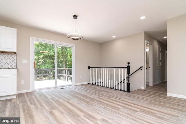 unfurnished room featuring light hardwood / wood-style flooring