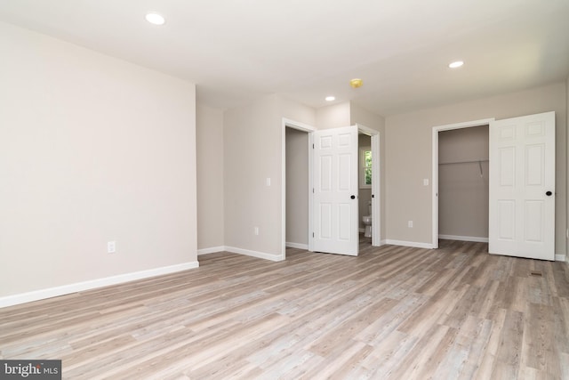 unfurnished bedroom with light hardwood / wood-style flooring