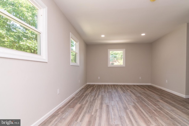 unfurnished room featuring hardwood / wood-style flooring