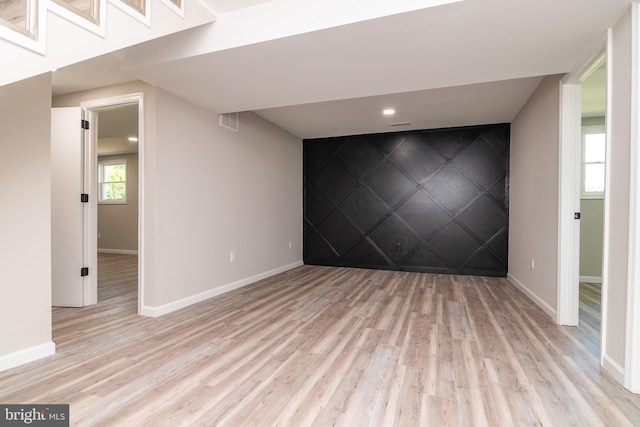 spare room with light hardwood / wood-style floors