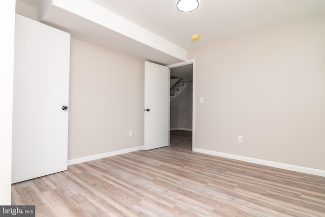 unfurnished bedroom featuring light wood-type flooring