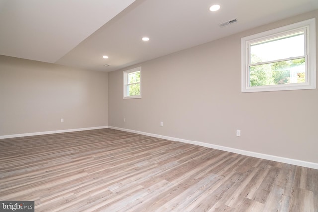 unfurnished room with light wood-type flooring