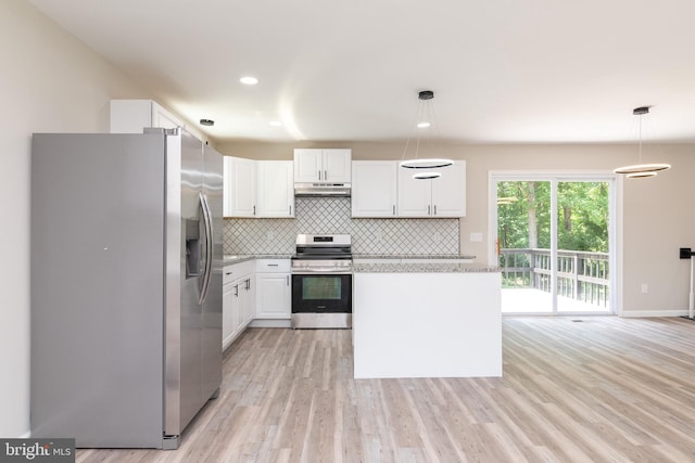 kitchen featuring pendant lighting, appliances with stainless steel finishes, white cabinetry, and light hardwood / wood-style floors