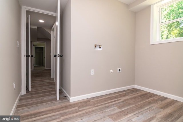 laundry room with light wood-type flooring, electric dryer hookup, and washer hookup