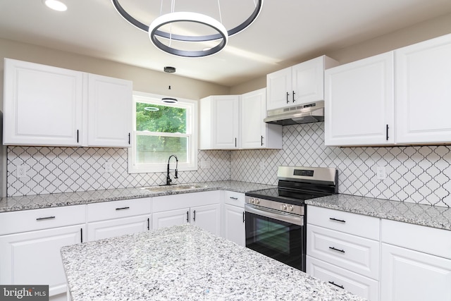 kitchen featuring white cabinets, sink, stainless steel range with electric cooktop, and backsplash