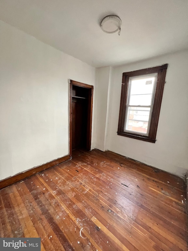 unfurnished bedroom featuring hardwood / wood-style floors