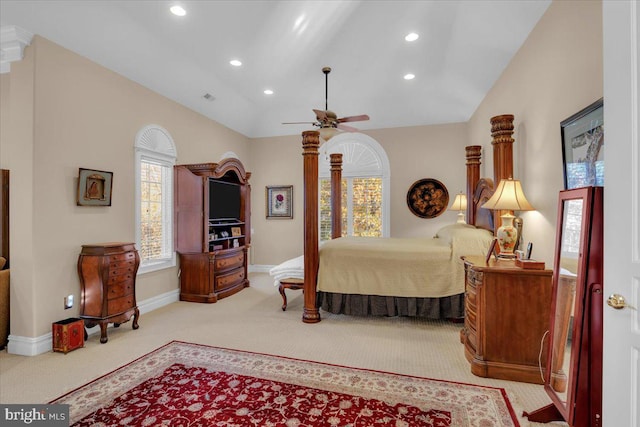 carpeted bedroom featuring vaulted ceiling and ceiling fan