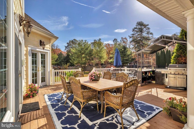 wooden terrace featuring grilling area