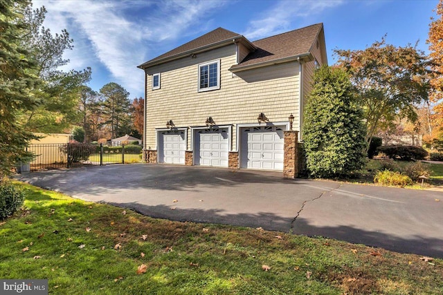 view of property exterior featuring a garage